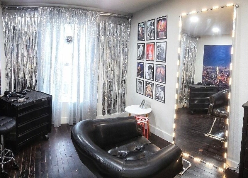 Chic salon interior at Jonny Styles, Austin, Texas, US with a large mirror and modern decor.