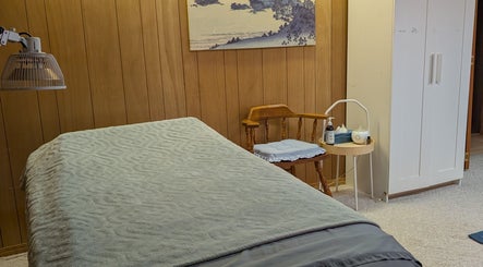 Relaxing treatment room at Alyssa Acupuncture & TCM in Edmonton, Alberta, CA with a massage table and soothing decor.