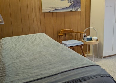 Calm therapy room at Alyssa Acupuncture & TCM, Edmonton, Alberta, CA with massage bed and ambient decor.