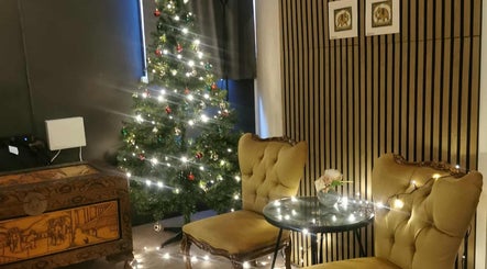 Cozy holiday decor at Chang Thai Massage, Ipswich, Queensland, AU with elegant chairs and a lit Christmas tree.