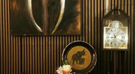 Decorative elephant plate and wall art at Chang Thai Massage, Ipswich, Queensland, AU for a serene atmosphere.