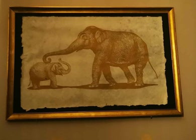 Framed elephant art at Chang Thai Massage, Ipswich, Queensland, AU, creating a warm, inviting atmosphere.