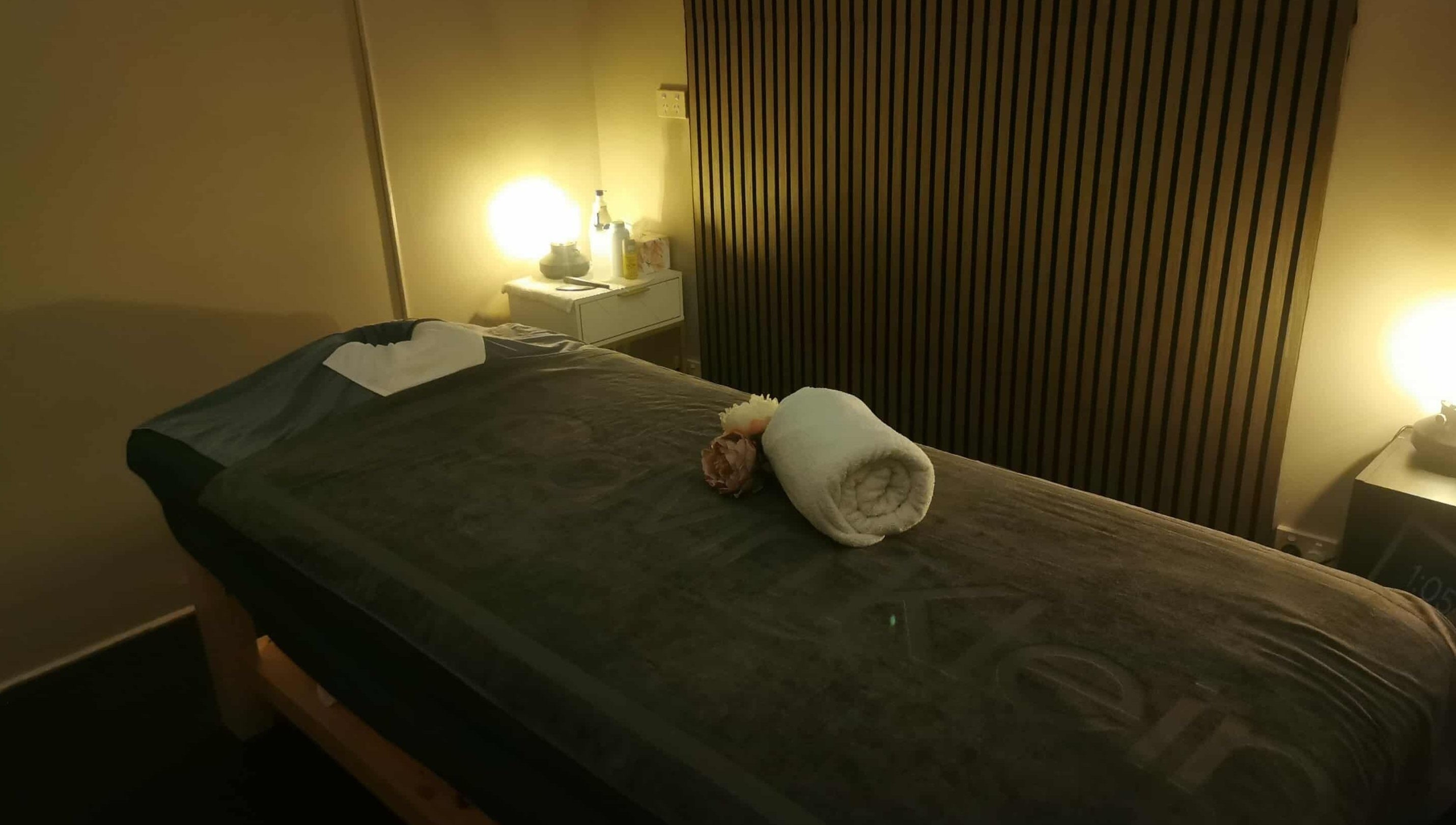 Cozy massage room at Chang Thai Remedial Massage, Ipswich, Queensland, AU with dim lighting and soft towels.