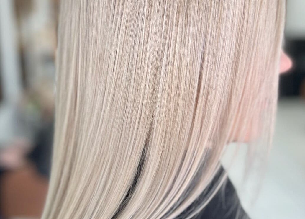 Sleek blonde hair straightened at Funk Hair Studio, Albion Park, New South Wales, AU.