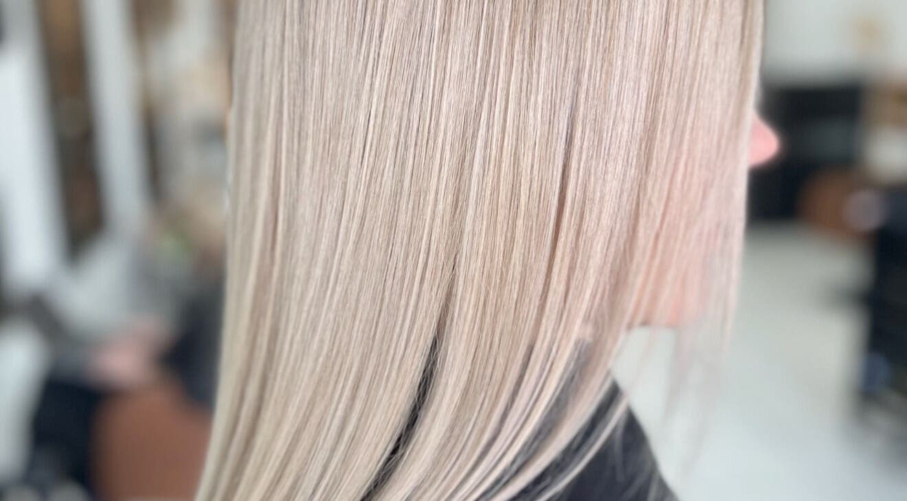 Sleek blonde hair straightened at Funk Hair Studio, Albion Park, New South Wales, AU.