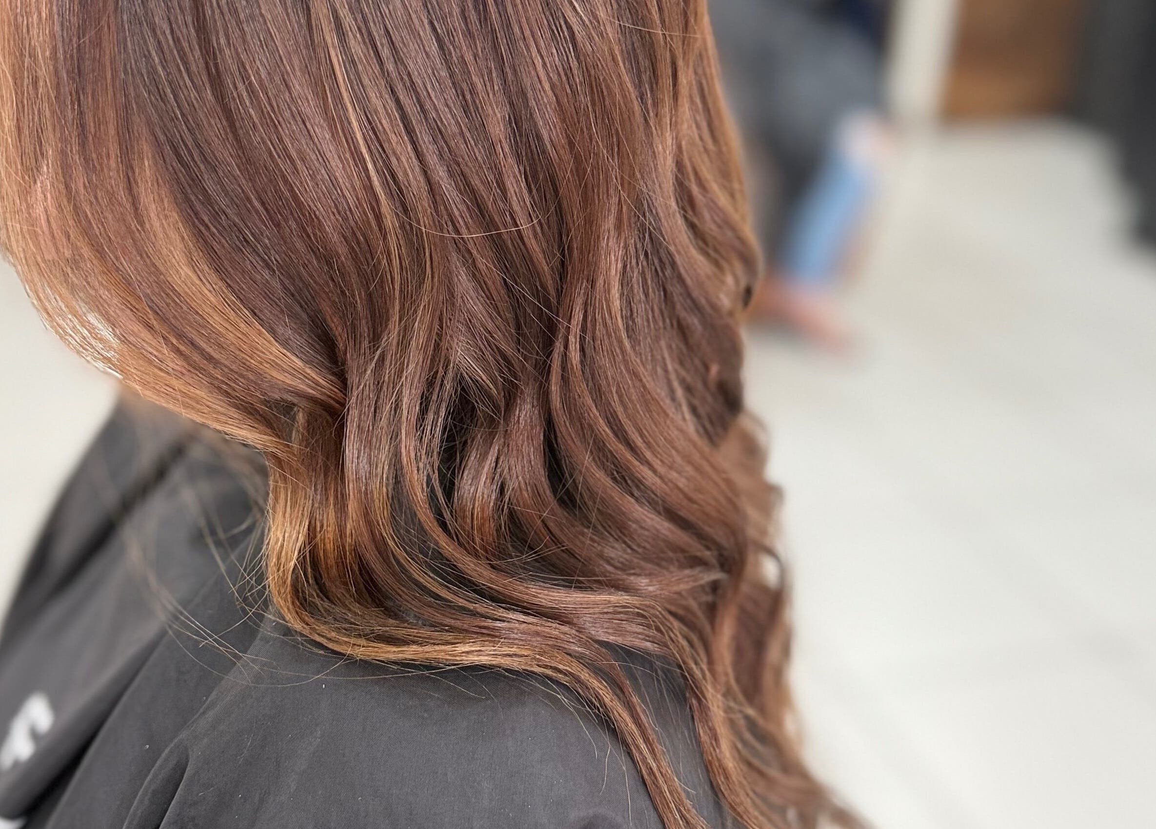 Beautiful wavy brown hair styling at Funk Hair Studio in Albion Park, New South Wales, AU.