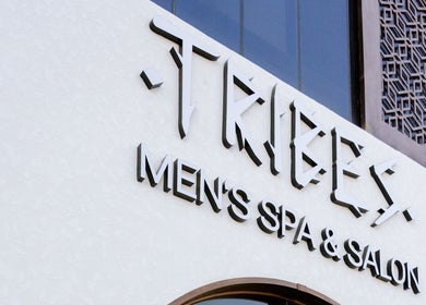 Entrance sign of Tribes Men's Spa & Salon on Mazoon St, Muscat, Muscat Governorate, OM.