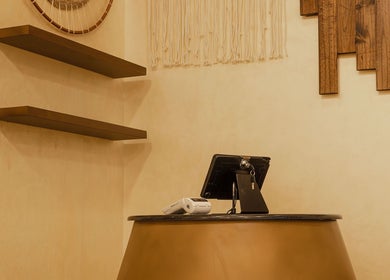 Chic reception desk at Tribes Men's Spa and Salon (Boshar), Muscat, Muscat Governorate, OM. Modern and welcoming.