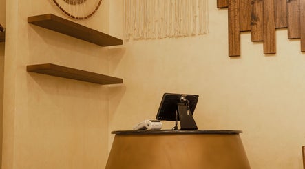Chic reception desk at Tribes Men's Spa and Salon (Boshar), Muscat, Muscat Governorate, OM. Modern and welcoming.