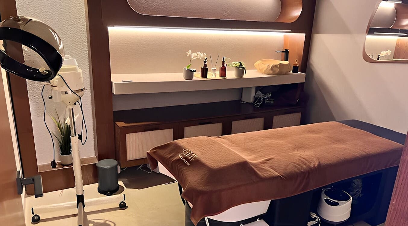 Luxurious spa room at Tribes Men's Spa & Salon (Mazoon st), Muscat with a treatment bed and elegant decor.