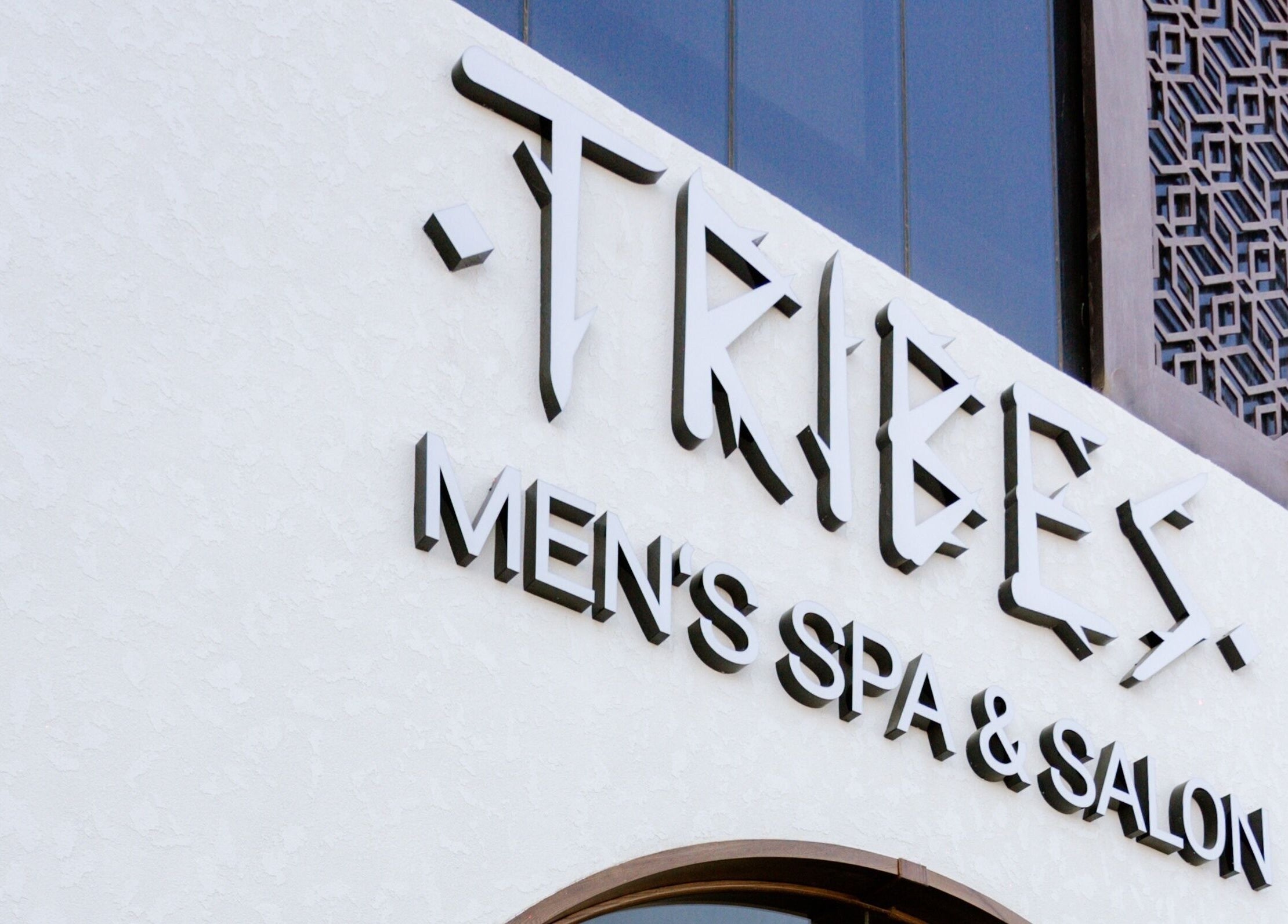Exterior sign of Tribes Men's Spa & Salon on Mazoon St, Muscat, Muscat Governorate, OM.