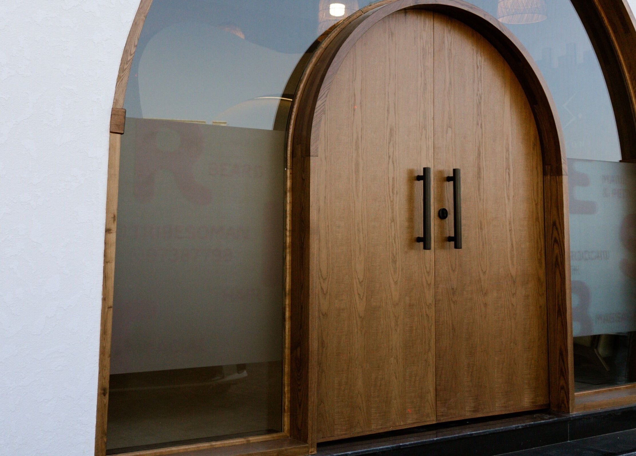 Sophisticated wooden door at Tribes Men's Spa & Salon (Mazoon st), Muscat, Muscat Governorate, OM.