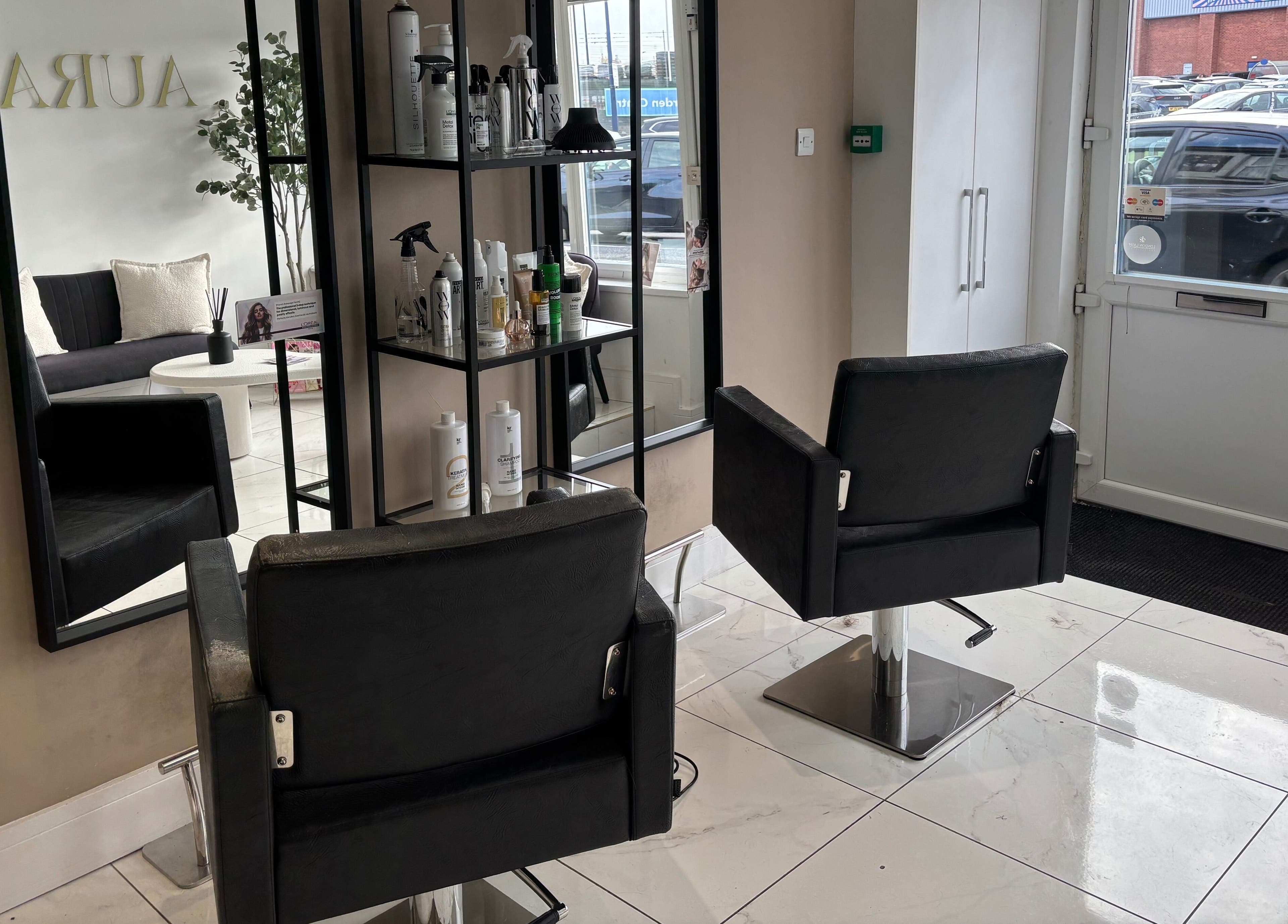 Modern salon interior at Picture Me Prestige with sleek chairs, Hyde, England, GB.
