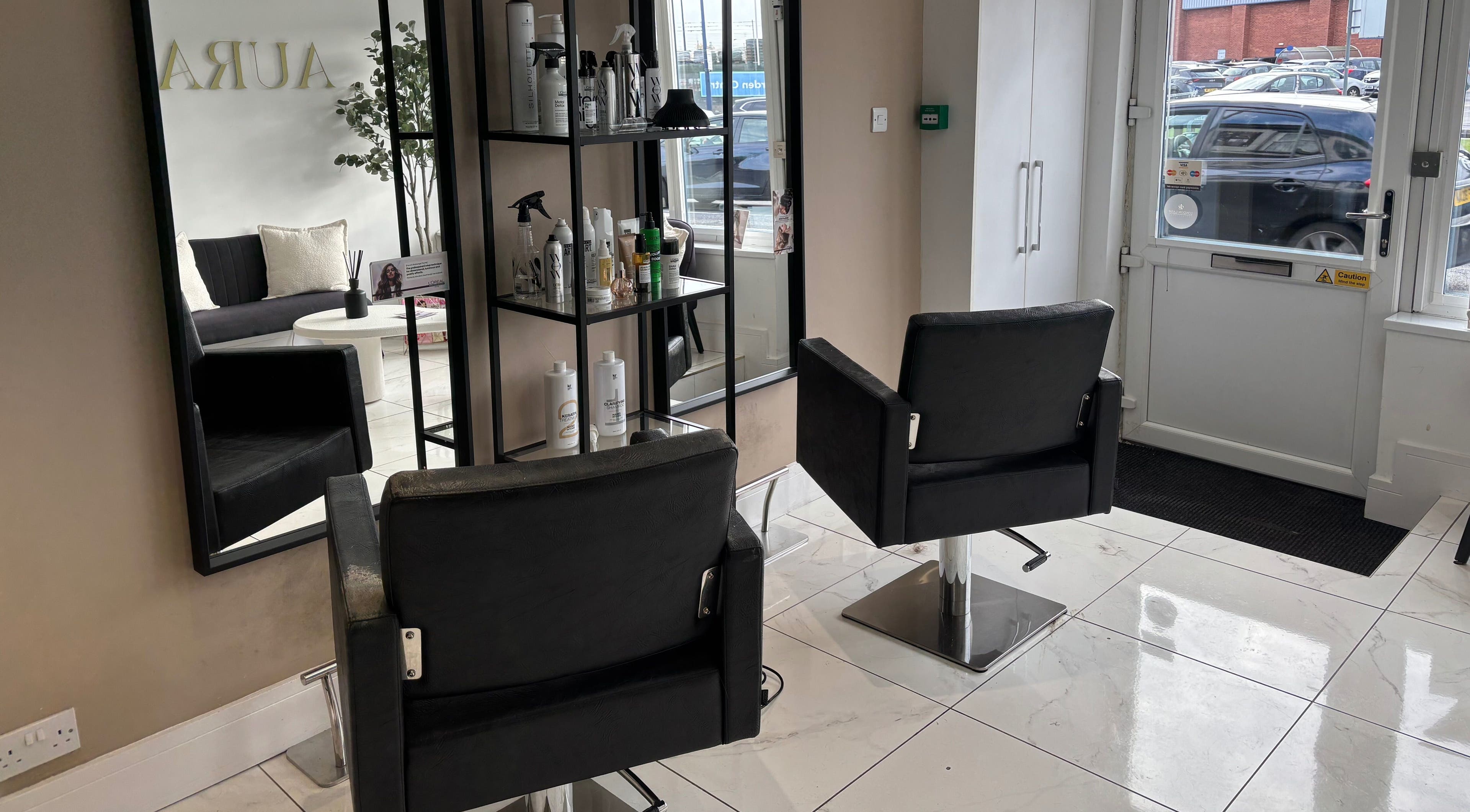 Modern salon interior at Picture Me Prestige with sleek chairs, Hyde, England, GB.