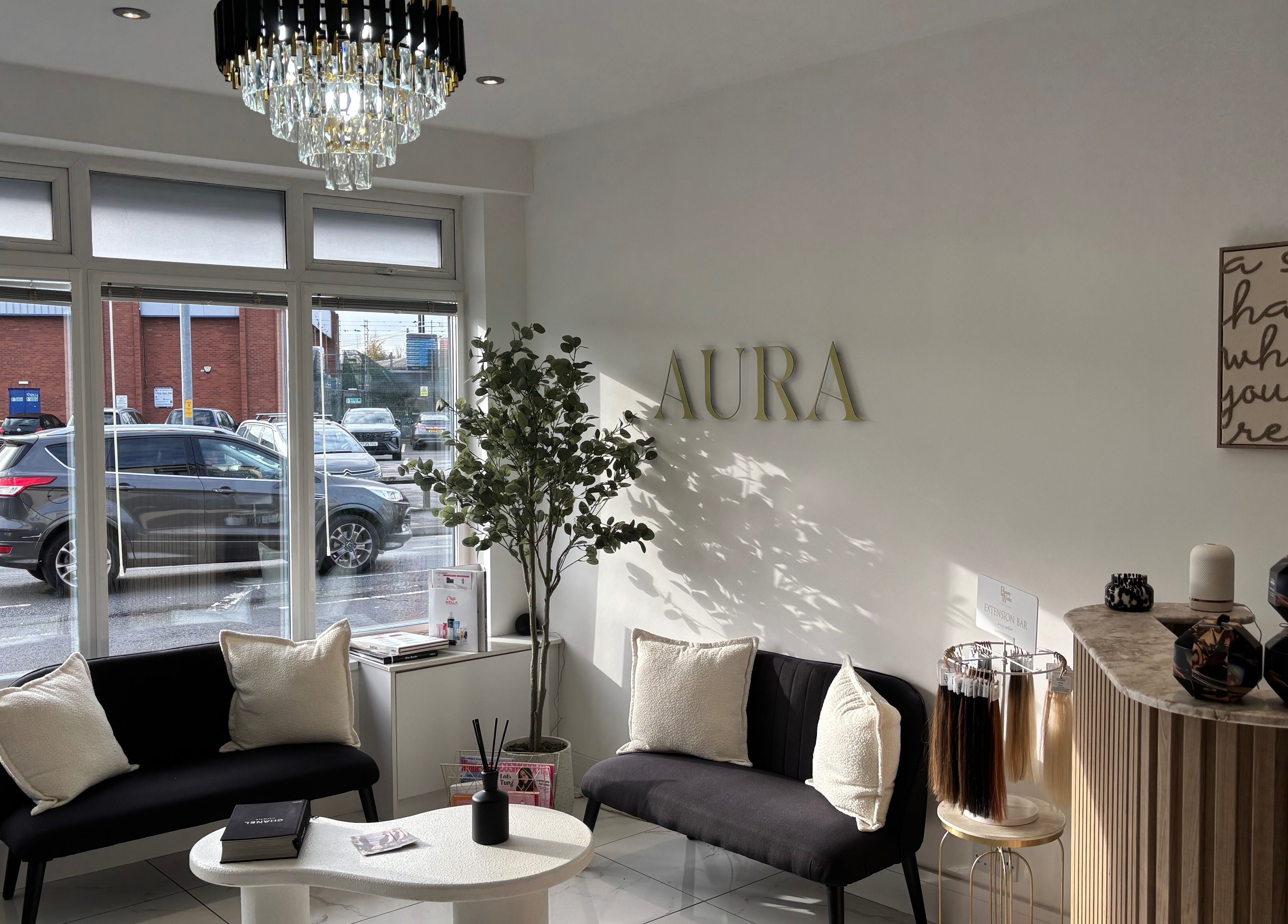 Elegant lounge at Picture Me Prestige, Hyde, England, GB with chic seating and decor under a modern chandelier.