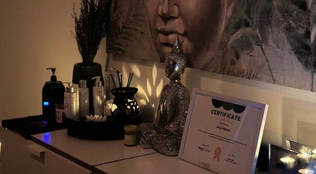 Serene massage room at Thai Massage Greenock, Greenock, Scotland, GB with Buddha statue and calming decor.