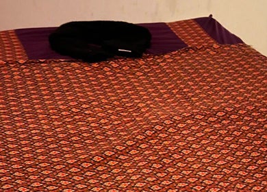 Cozy massage mat at Thai Massage Greenock, Greenock, Scotland, GB, showcasing traditional Thai decor.