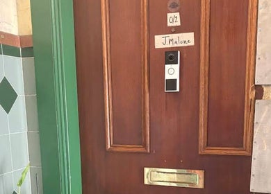 Entrance to Thai Massage Greenock with wooden door in Greenock, Scotland, GB.