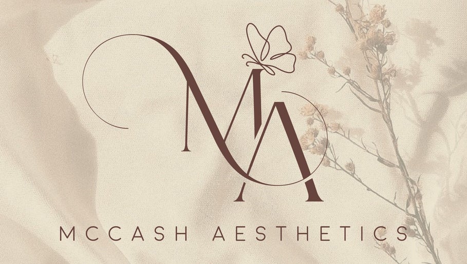 Elegant logo for McCash Aesthetics in Yeovil, England, GB featuring graceful lettering and floral accents.