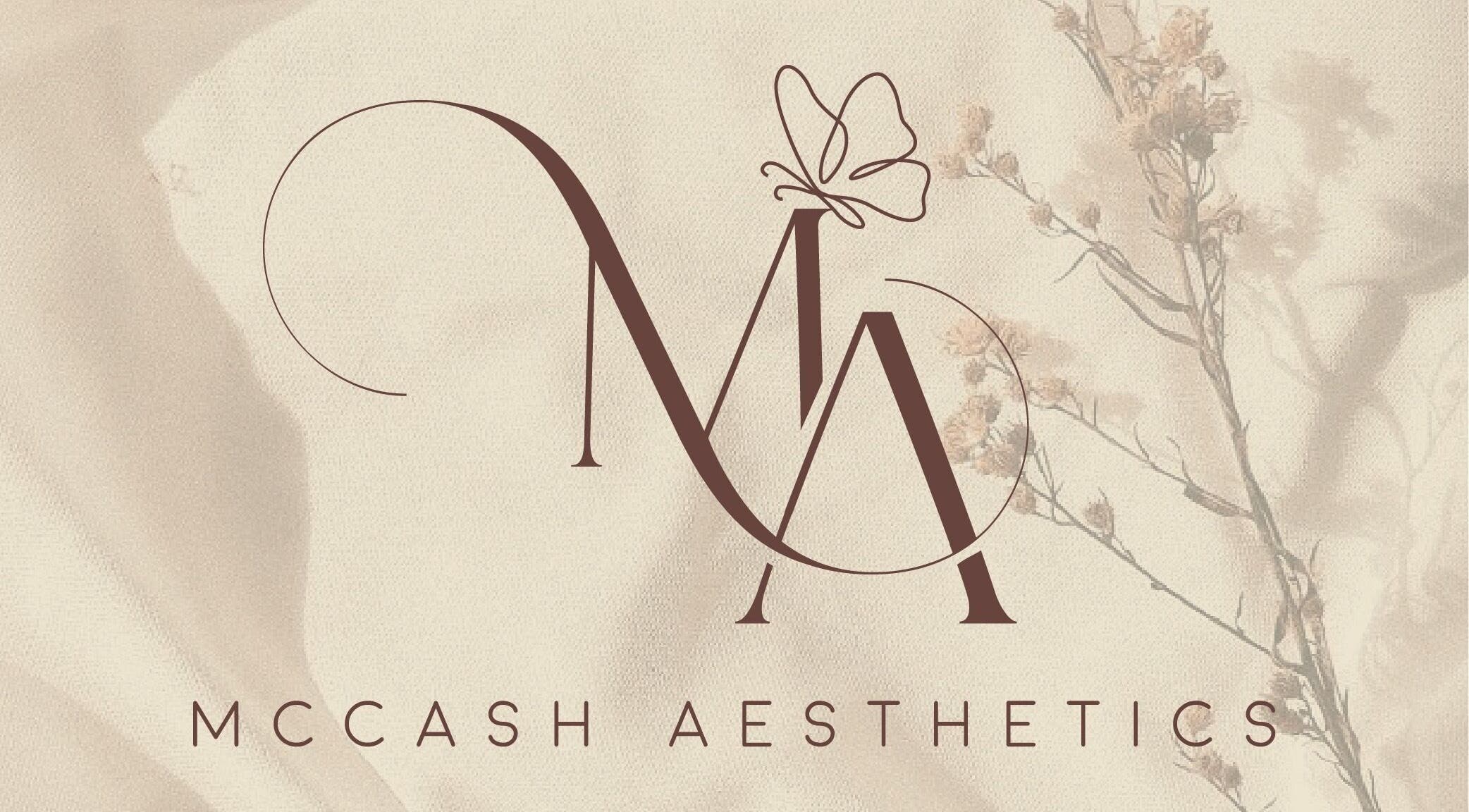 Elegant logo for McCash Aesthetics in Yeovil, England, GB featuring graceful lettering and floral accents.