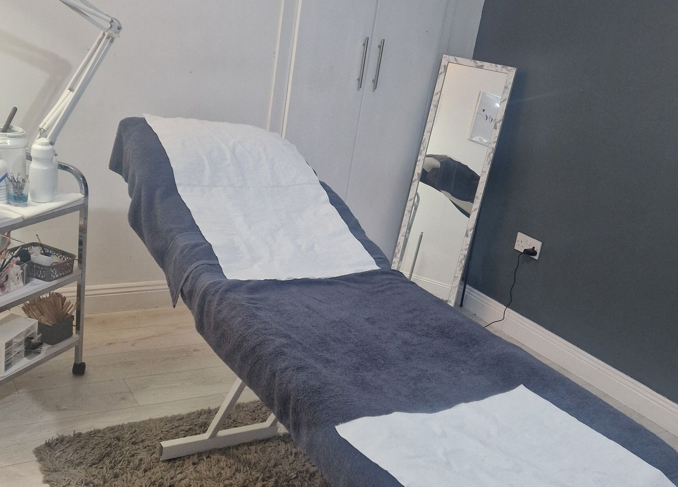 Relaxing treatment room at Inner Beauty Gorey, Gorey, County Wexford, IE showcasing a comfortable spa bed.