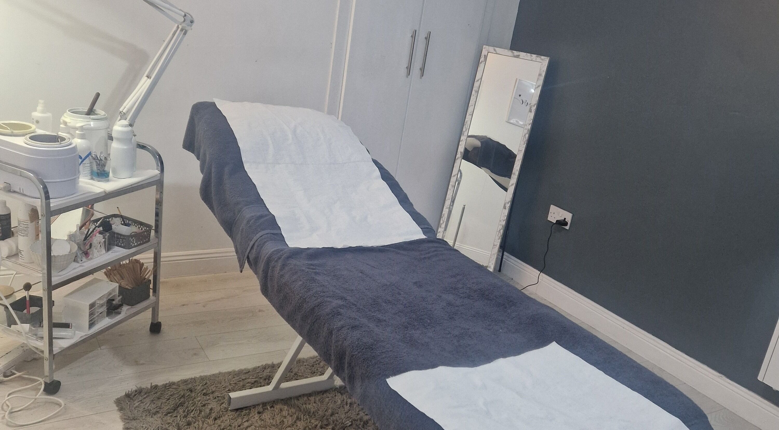 Relaxing treatment room at Inner Beauty Gorey, Gorey, County Wexford, IE showcasing a comfortable spa bed.