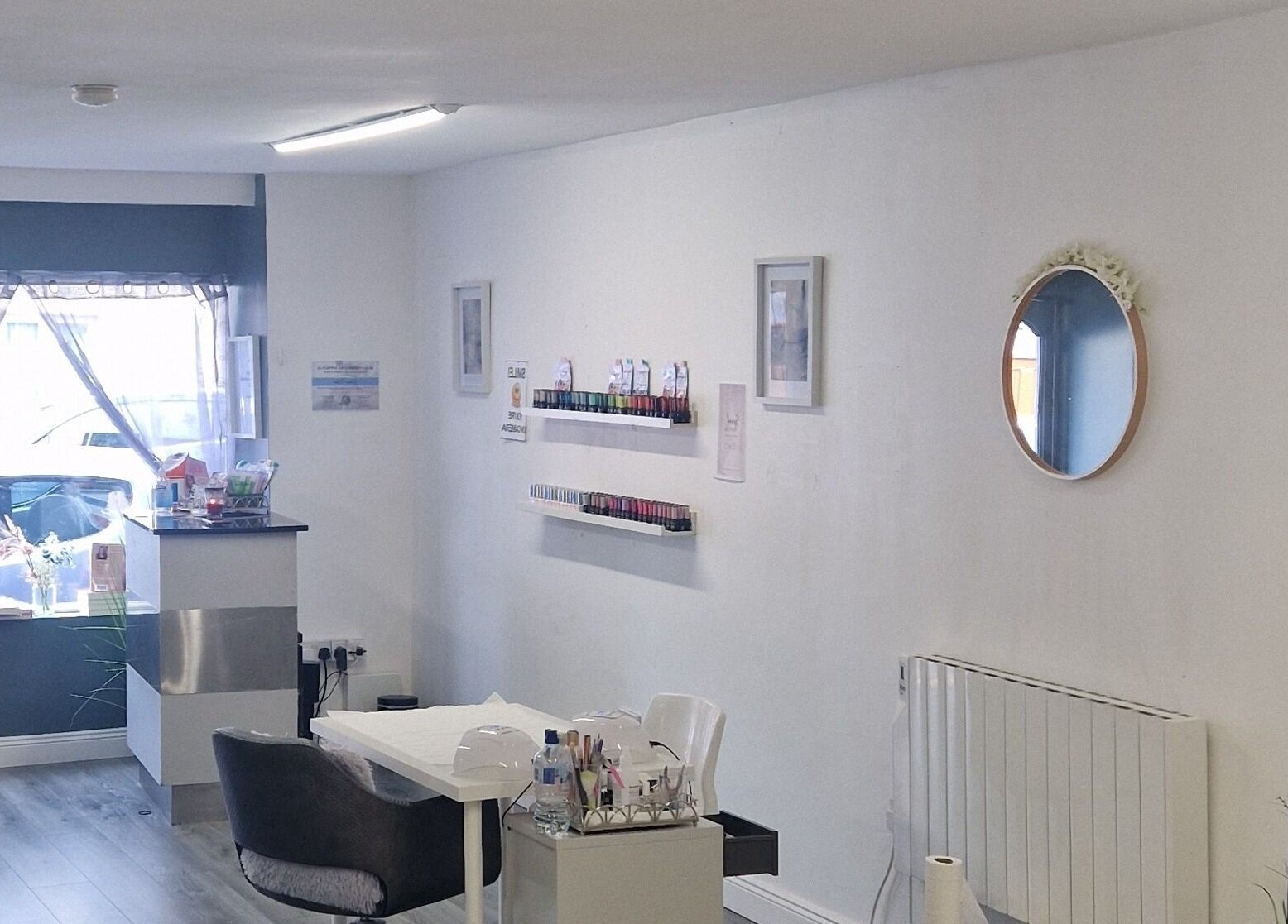 Serene salon interior at Inner Beauty Gorey, Gorey, County Wexford, IE, showcasing nail polish displays and cozy seating.