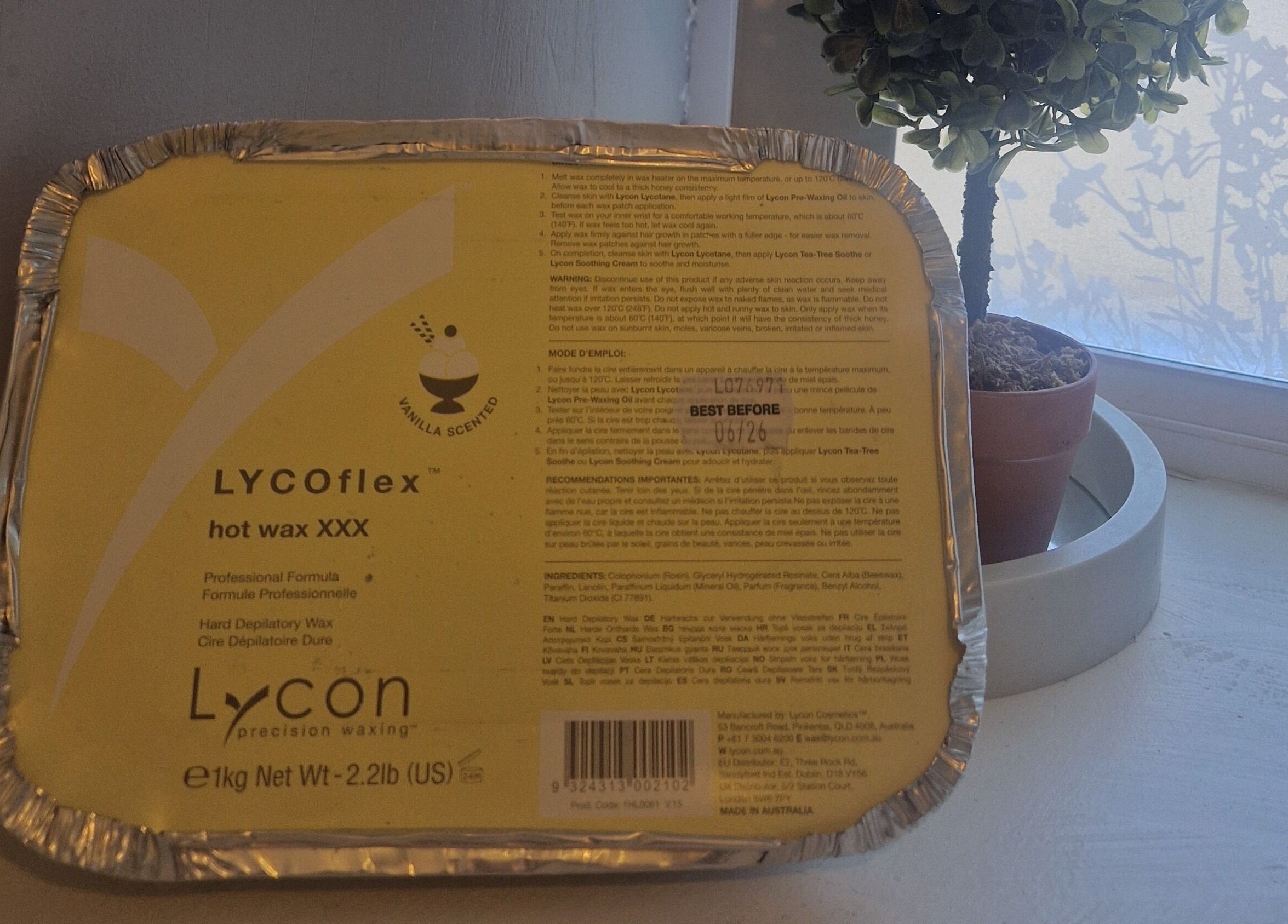 Lycoflex hot wax displayed at Inner Beauty Gorey, Gorey, County Wexford, IE, next to a serene plant.