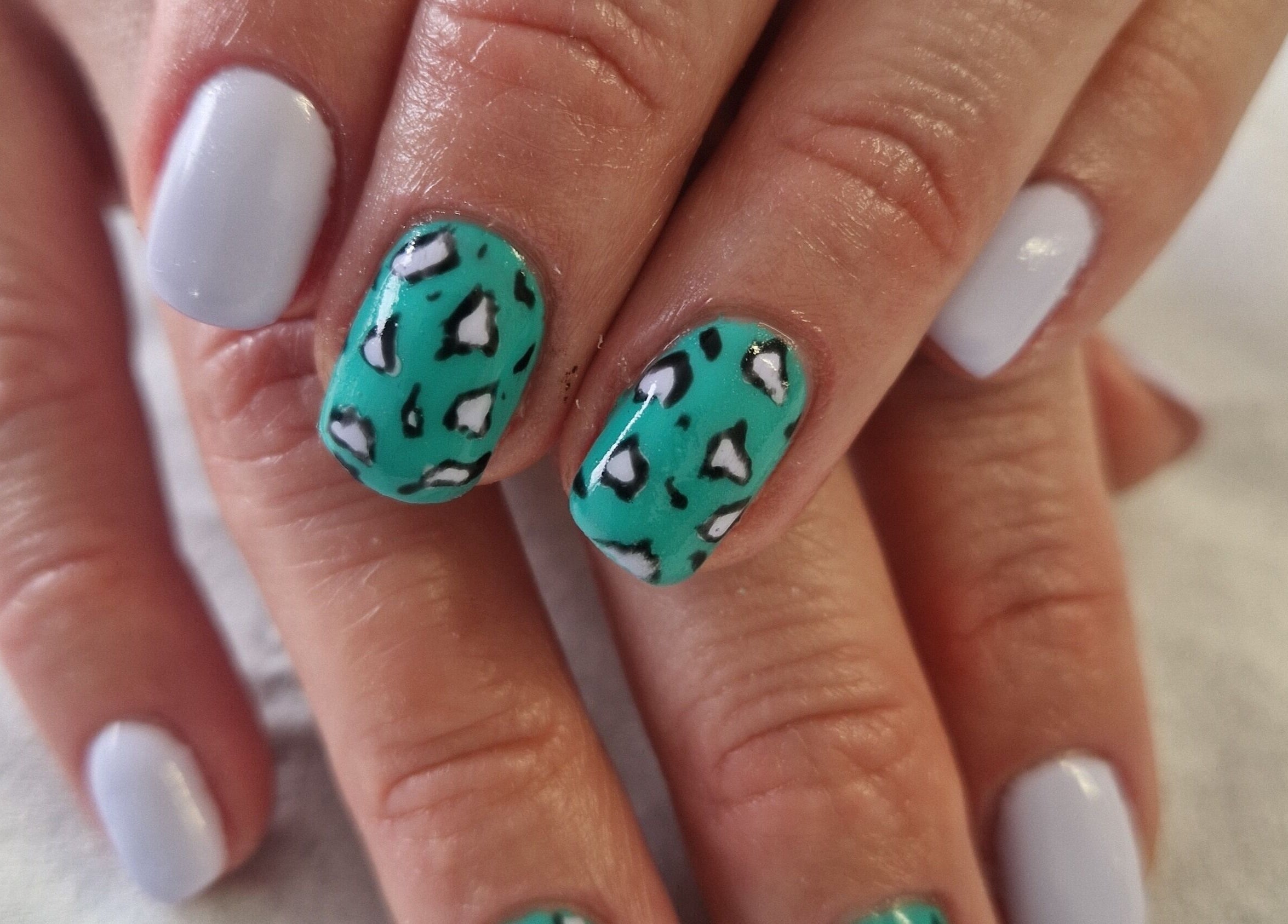 Stylish nail art with teal and white design at Inner Beauty Gorey, Gorey, County Wexford, IE.