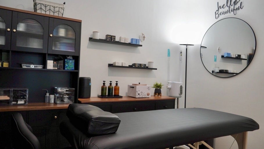 Relaxing treatment room at Kendra, Downey, California, US, featuring a massage table and elegant decor.