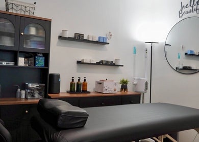 Relaxing treatment room at Kendra, Downey, California, US, featuring a massage table and elegant decor.