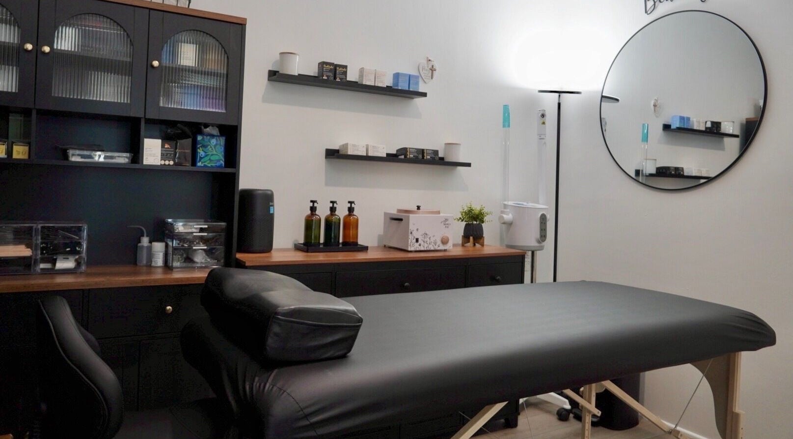 Cozy treatment room at Pulchrify by Kendra, Downey, California, US, featuring a massage table and wellness products.