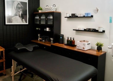 Relaxing wellness suite at Pulchrify by Kendra, Downey, California, US with massage bed and skincare products.