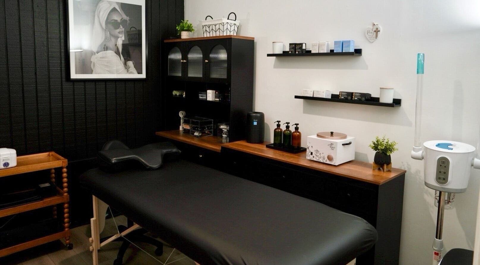 Relaxing wellness suite at Pulchrify by Kendra, Downey, California, US with massage bed and skincare products.