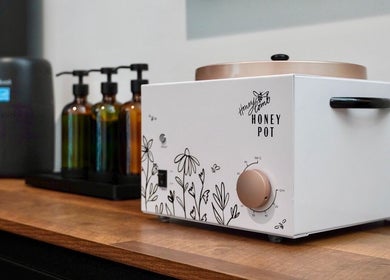 Warm wax and oils setup at Pulchrify by Kendra, Downey, California, US, offering a serene beauty experience.
