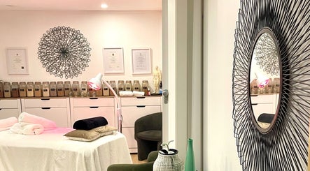 Tranquil massage room at Magic Turtle Clinic, Avalon Beach, New South Wales, AU, with decorative mirror and soft lighting.