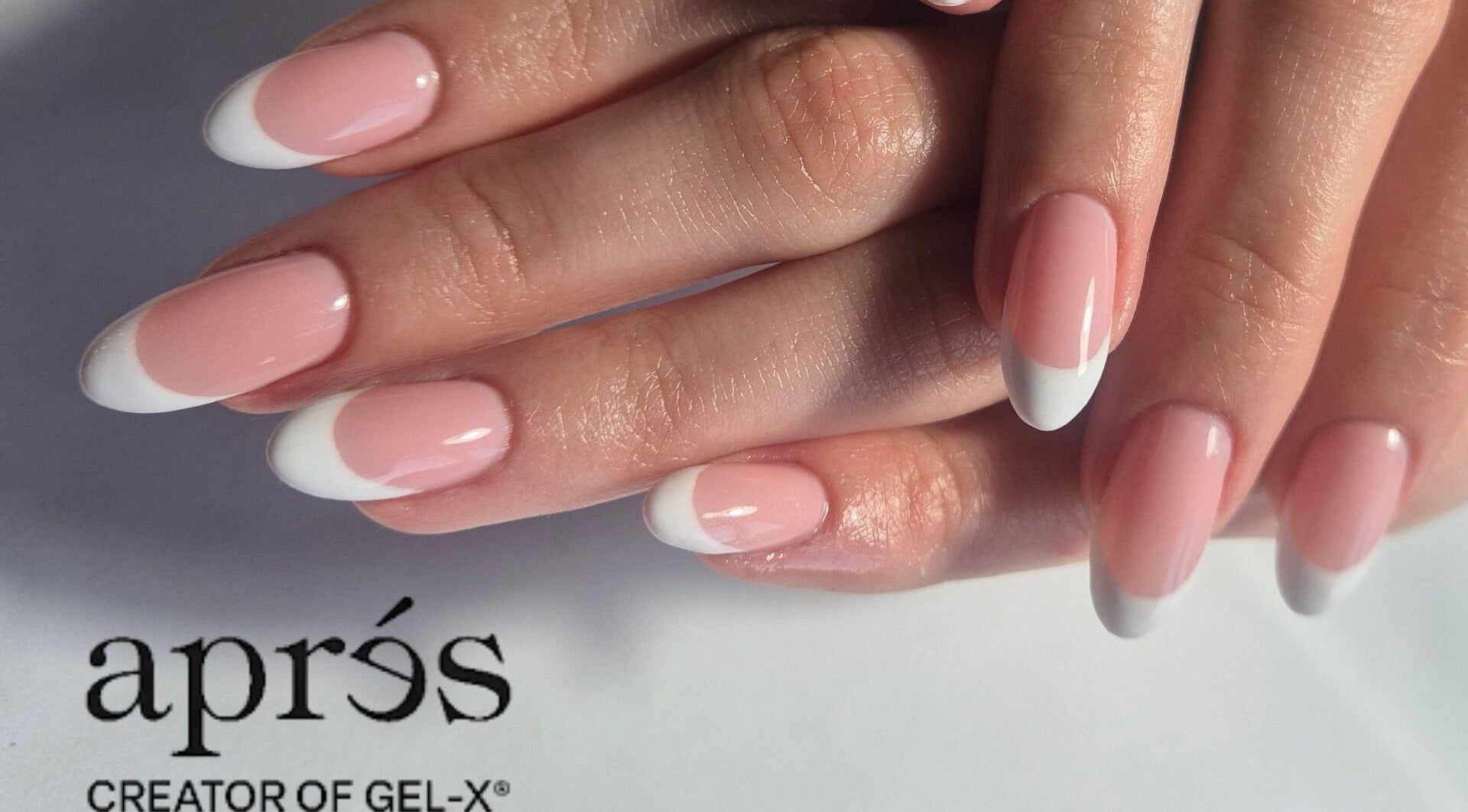 Elegant French tip nails at Shreen Gayle Works, Wallington, England, GB, showcasing flawless pink and white design.