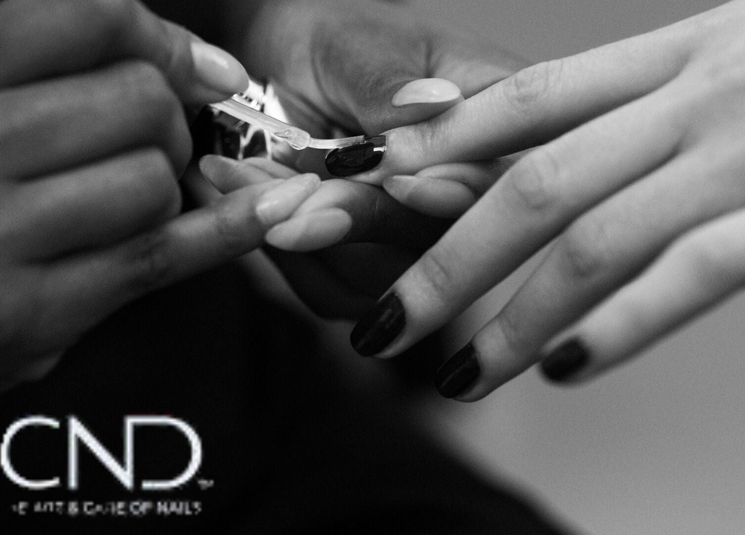 Nail technician applying polish at Shreen Gayle Works, Wallington, England, GB.