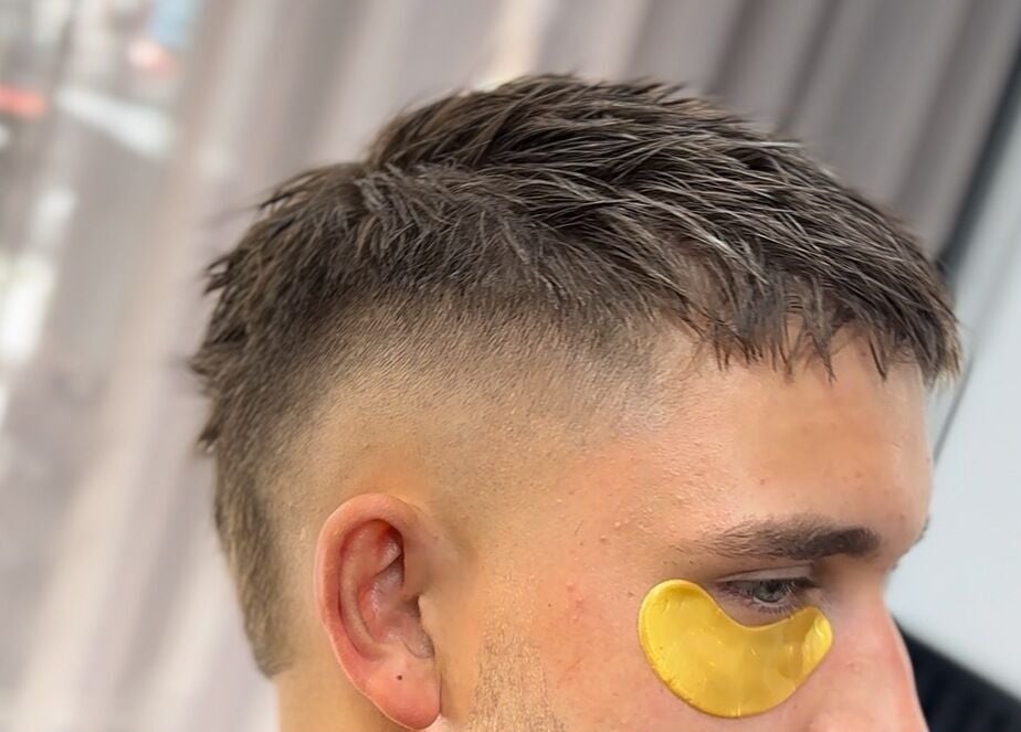 Modern fade haircut with eye patch at THE LOCO BARBER BALI, Bali, Bali, ID.