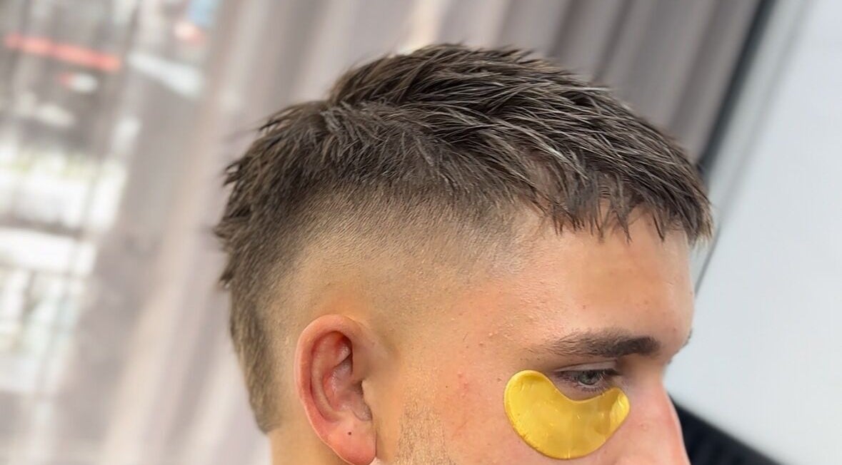 Modern fade haircut with eye patch at THE LOCO BARBER BALI, Bali, Bali, ID.