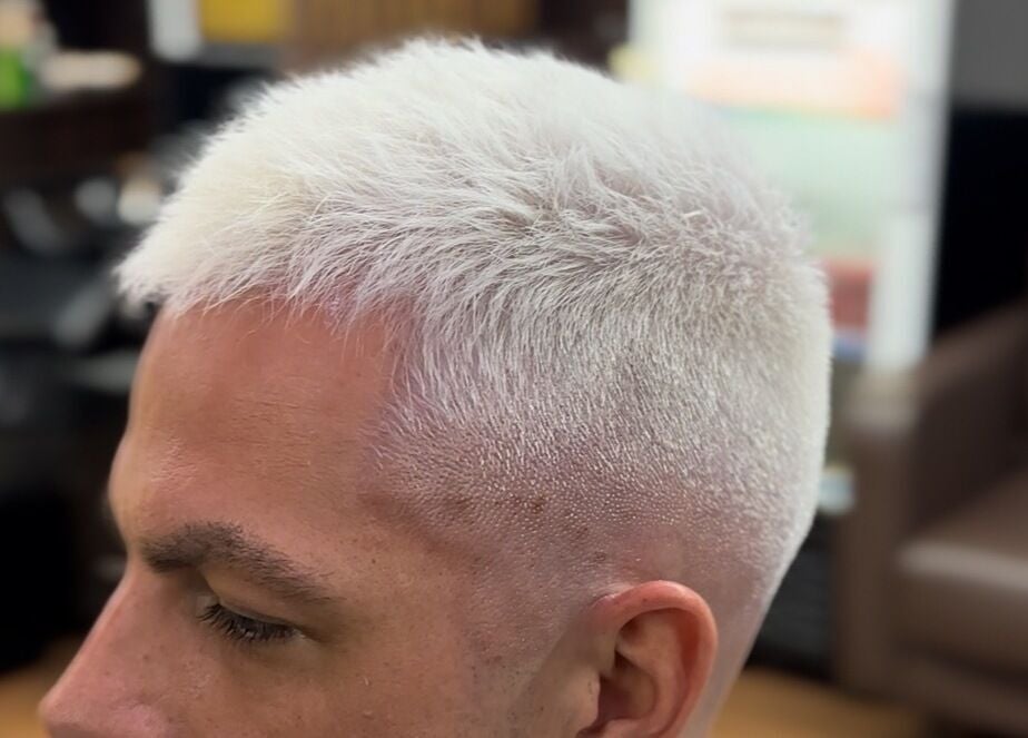 Close-up of trendy platinum blonde haircut at THE LOCO BARBER BALI, Bali, Bali, ID. Modern style ambiance.