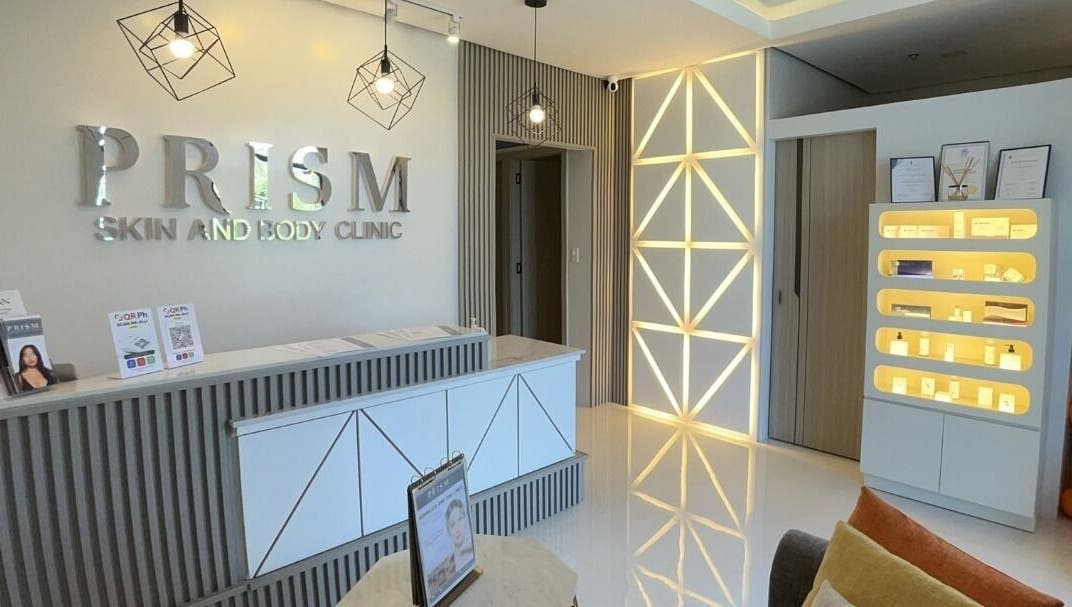 Stylish reception area of PRISM Clinic in Angeles, Central Luzon, PH, showcasing modern design and lighting.