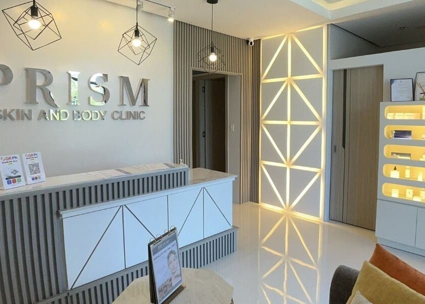 Stylish reception area of PRISM Clinic in Angeles, Central Luzon, PH, showcasing modern design and lighting.