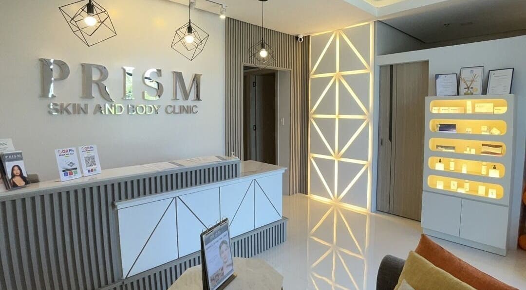 Stylish reception area of PRISM Clinic in Angeles, Central Luzon, PH, showcasing modern design and lighting.