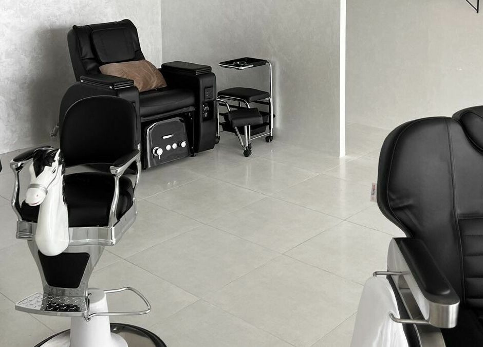 Modern barber chairs at Kev Lounge Barber, Umm Al Quwain, Emirate Of Umm Al Quwain, AE.