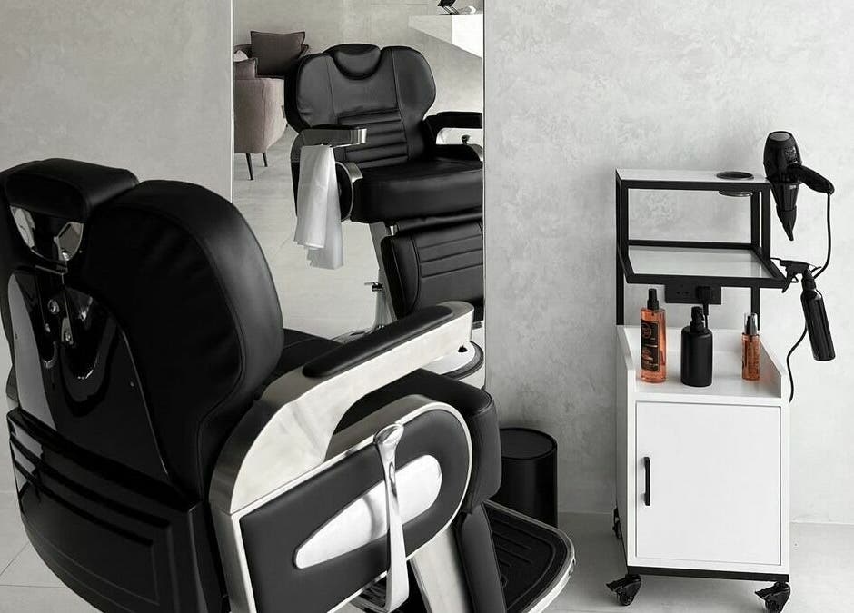Modern barber chair and tools at Kev Lounge Barber, Umm Al Quwain, Emirate Of Umm Al Quwain, AE, exuding luxury.