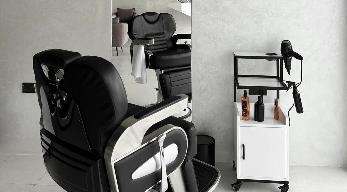 Modern barber chair and tools at Kev Lounge Barber, Umm Al Quwain, Emirate Of Umm Al Quwain, AE, exuding luxury.