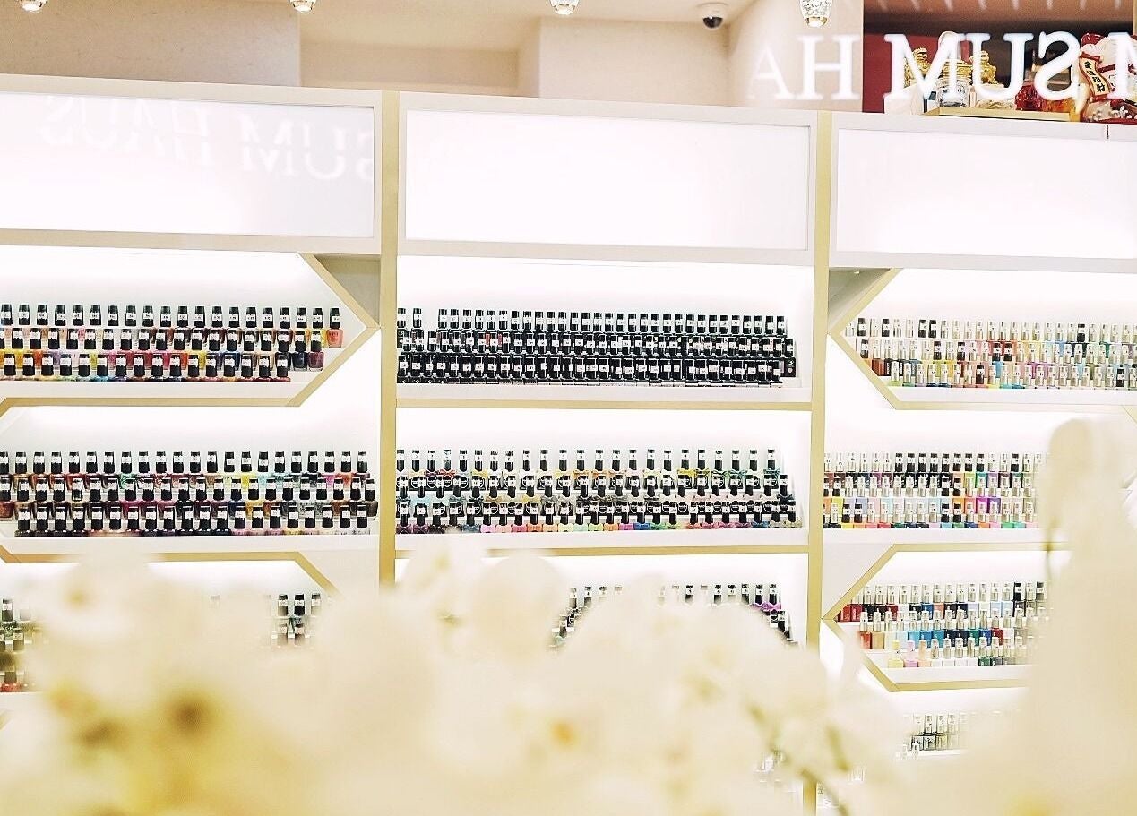 Nail polish selection at Lush & Glow, Singapore, Singapore, SG. Rows of colorful polish bottles on display shelves.