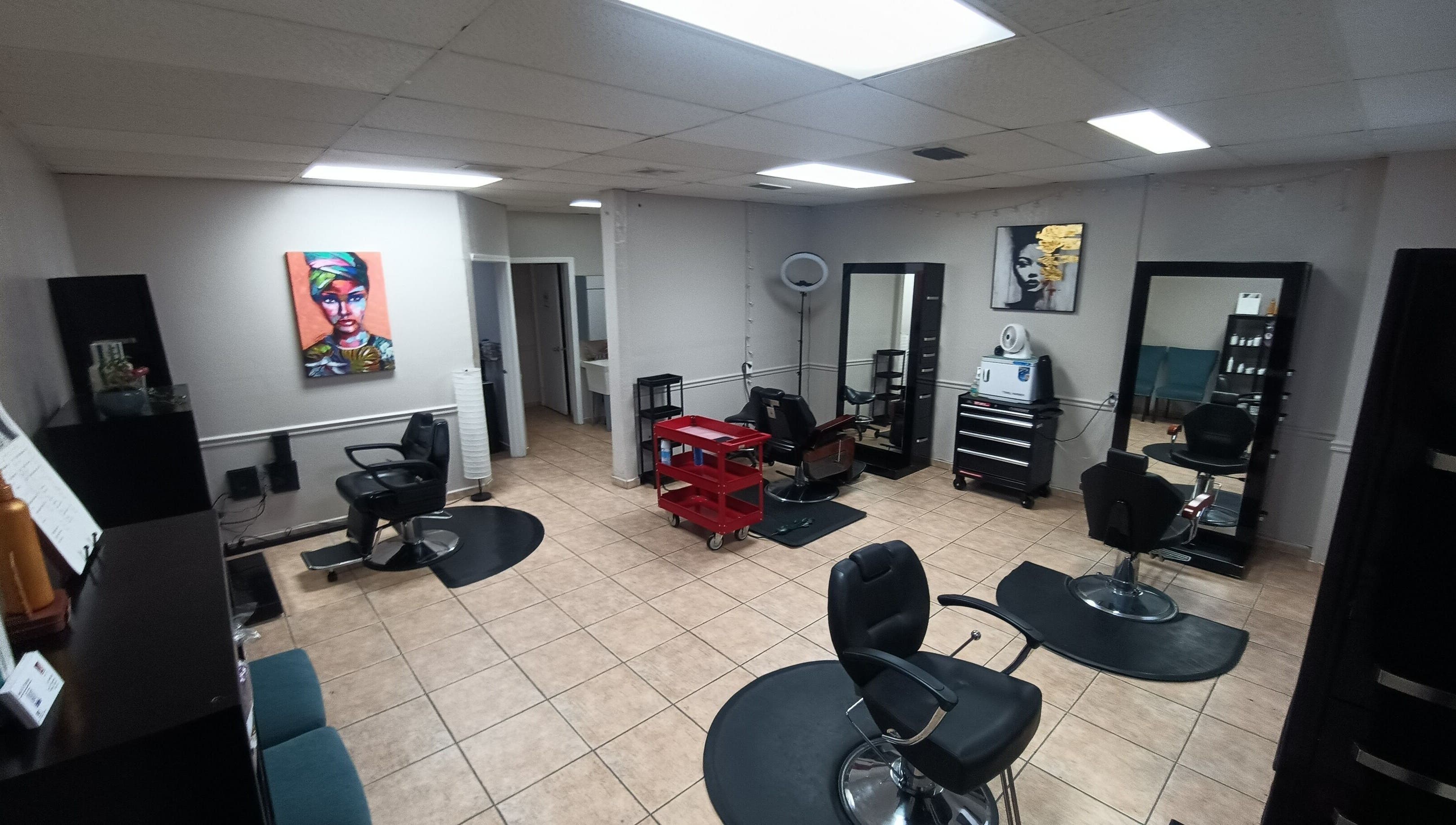 Interior of AJ Styles You Salon in Orlando, Florida, US featuring stylish chairs and mirrors.