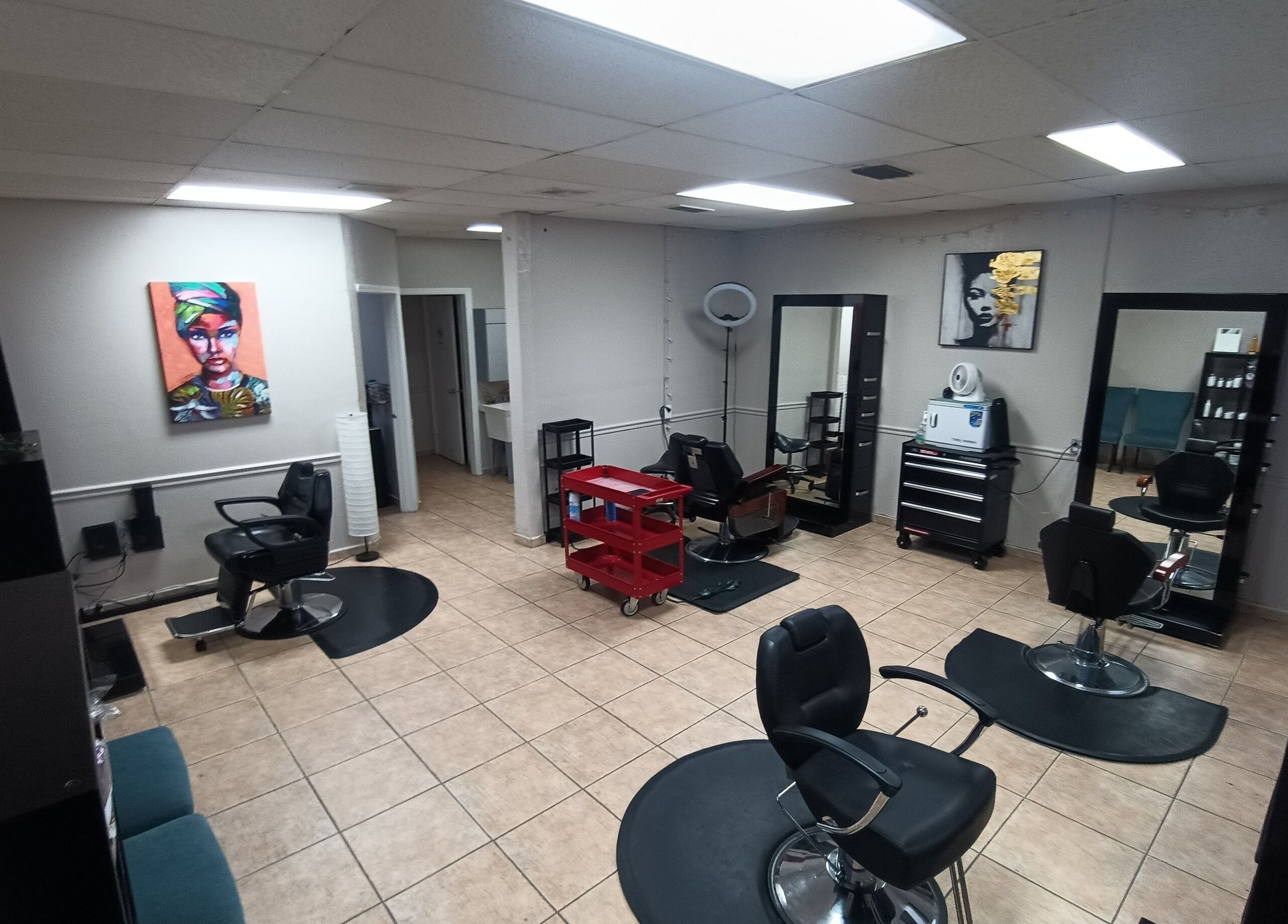 Interior of AJ Styles You Salon in Orlando, Florida, US featuring stylish chairs and mirrors.